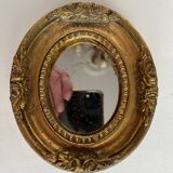 Small old mirror in gilded wood