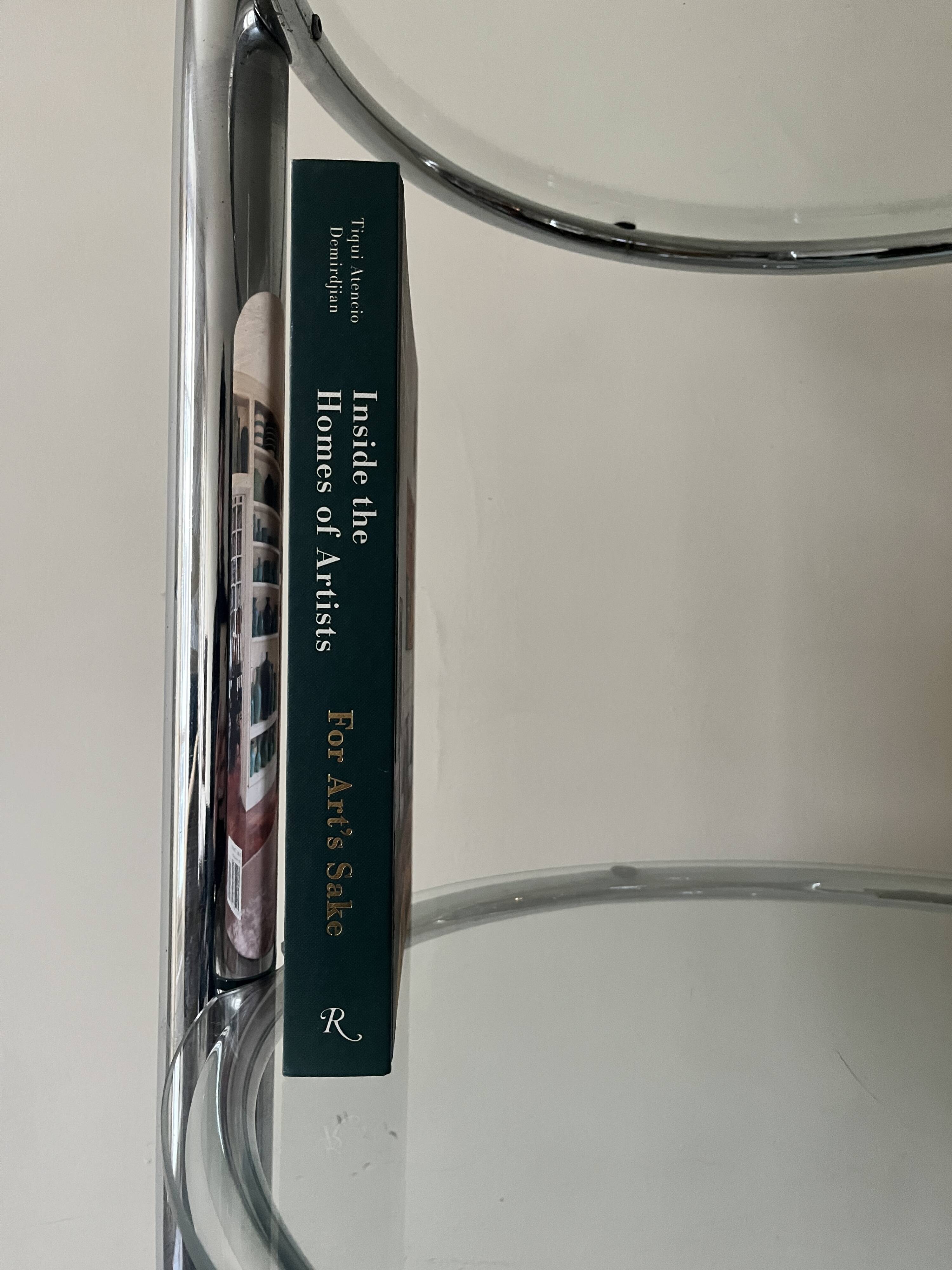 Round tubular bookcase in chrome and glass, 1970 design