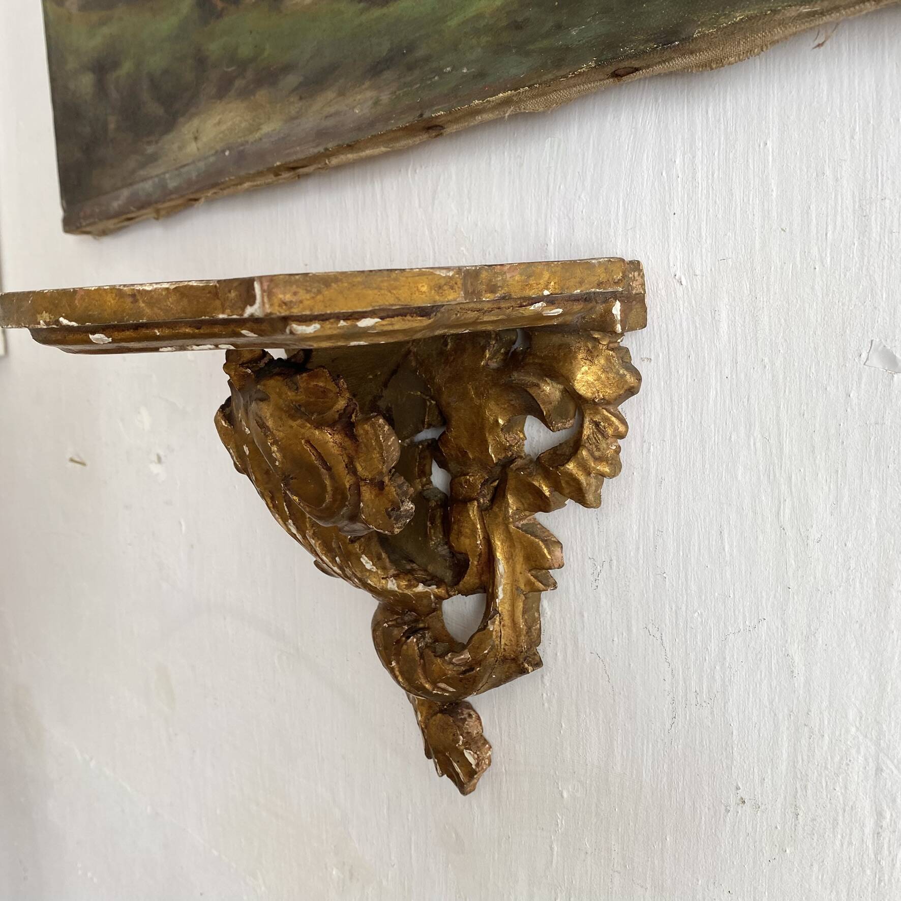 Antique wall console in wood and gilded stucco.