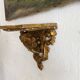 Antique wall console in wood and gilded stucco.