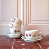 Four large cups and their tea service cups