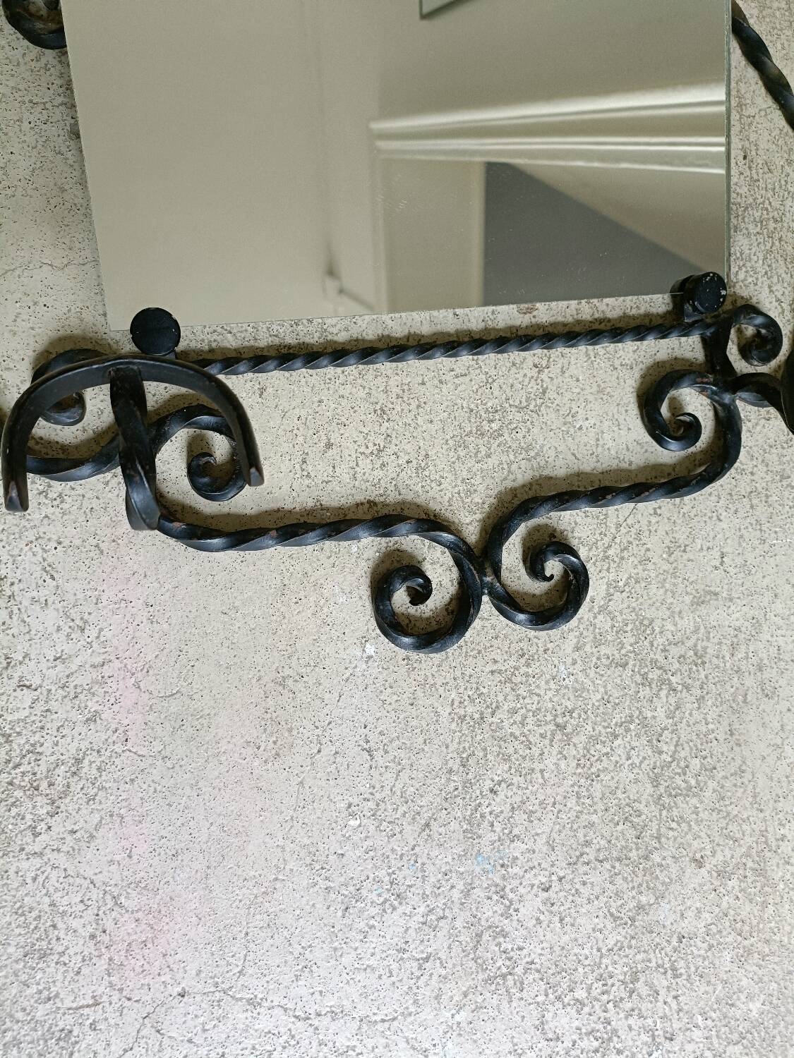 Twisted wrought iron wall-mounted coat rack