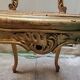 Antique rococo chair in gilded wood and caning