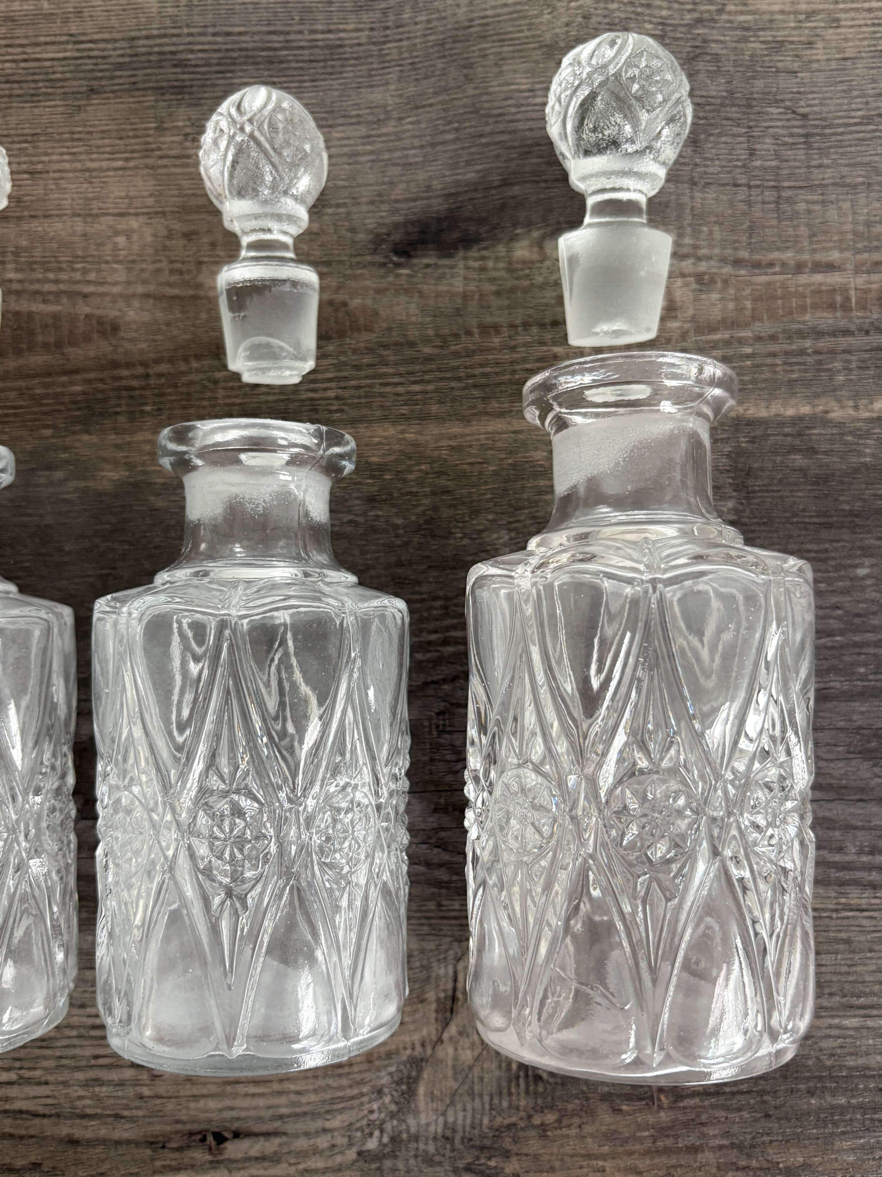 Set of 4 molded crystal bottles – Val Saint Lambert