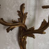 Bronze wall sconces decorated with acanthus leaves.