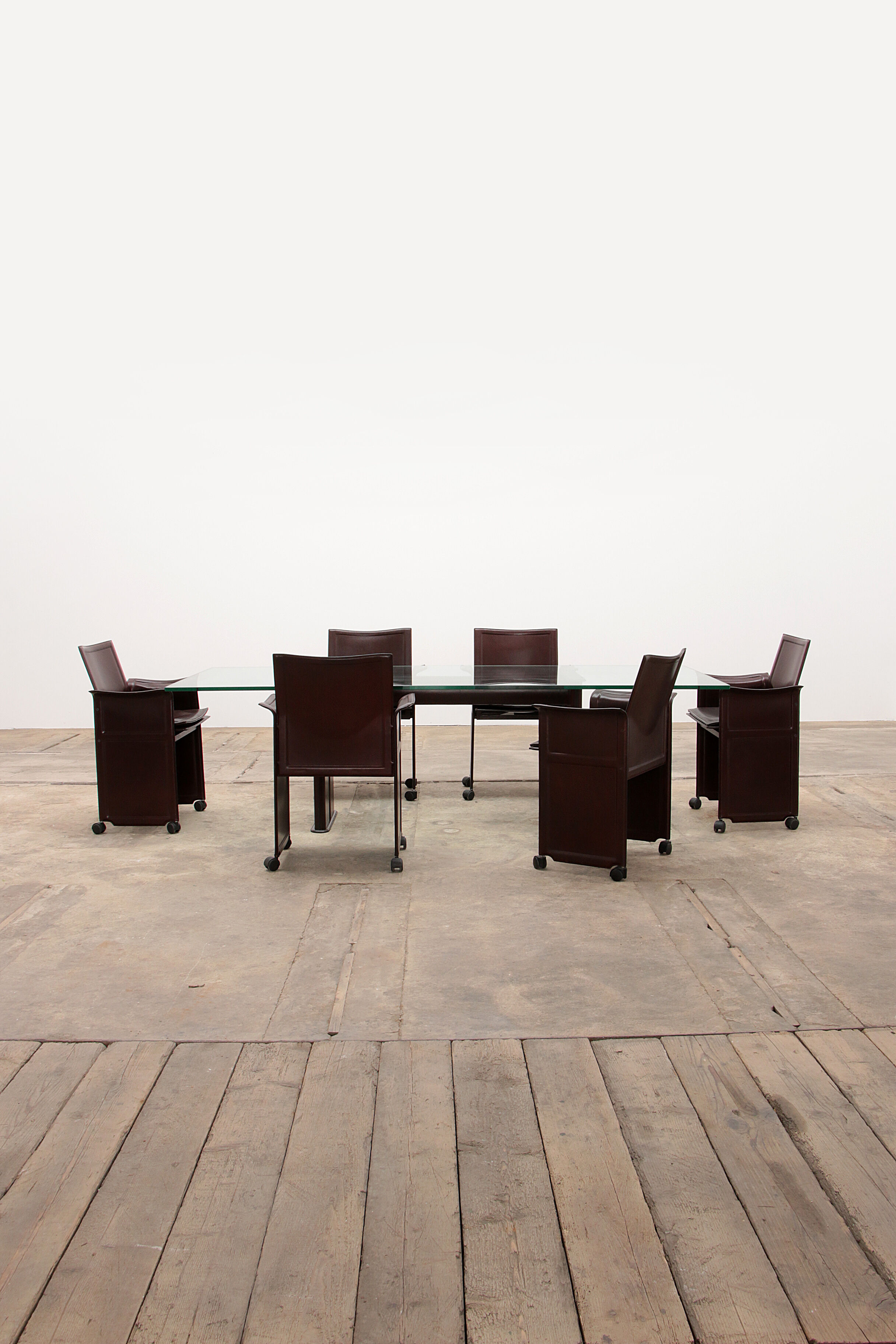 Tito Agnoli for Matteo Grassi leather dining table and six chairs