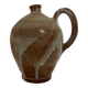 Patinated stoneware jug