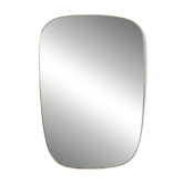 Miroir cerclé de laiton doré. 1980