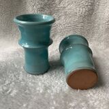 Two lovely turquoise ceramic mug vases.