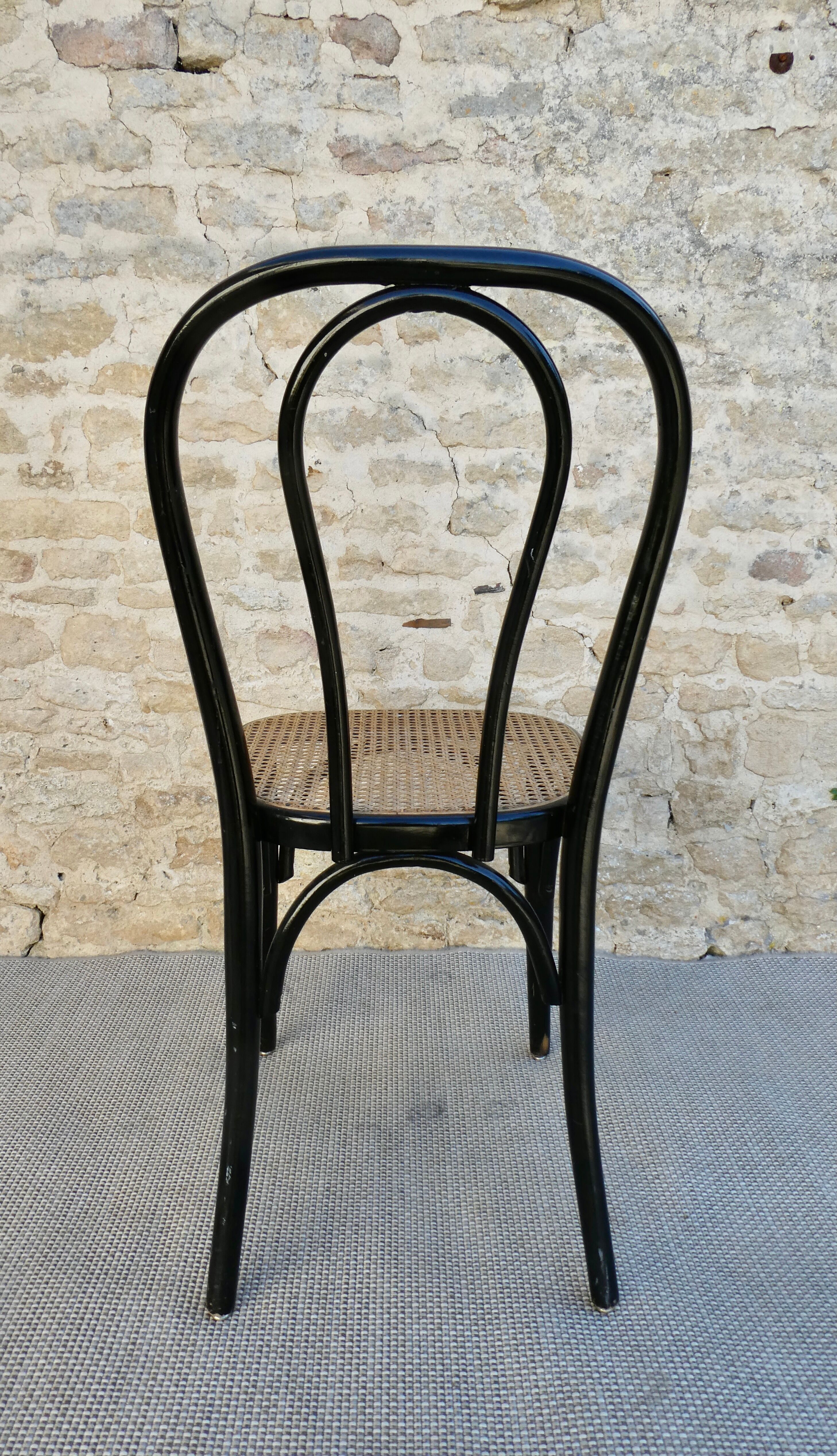 Bistro chair in black lacquered wood and seat in cannage