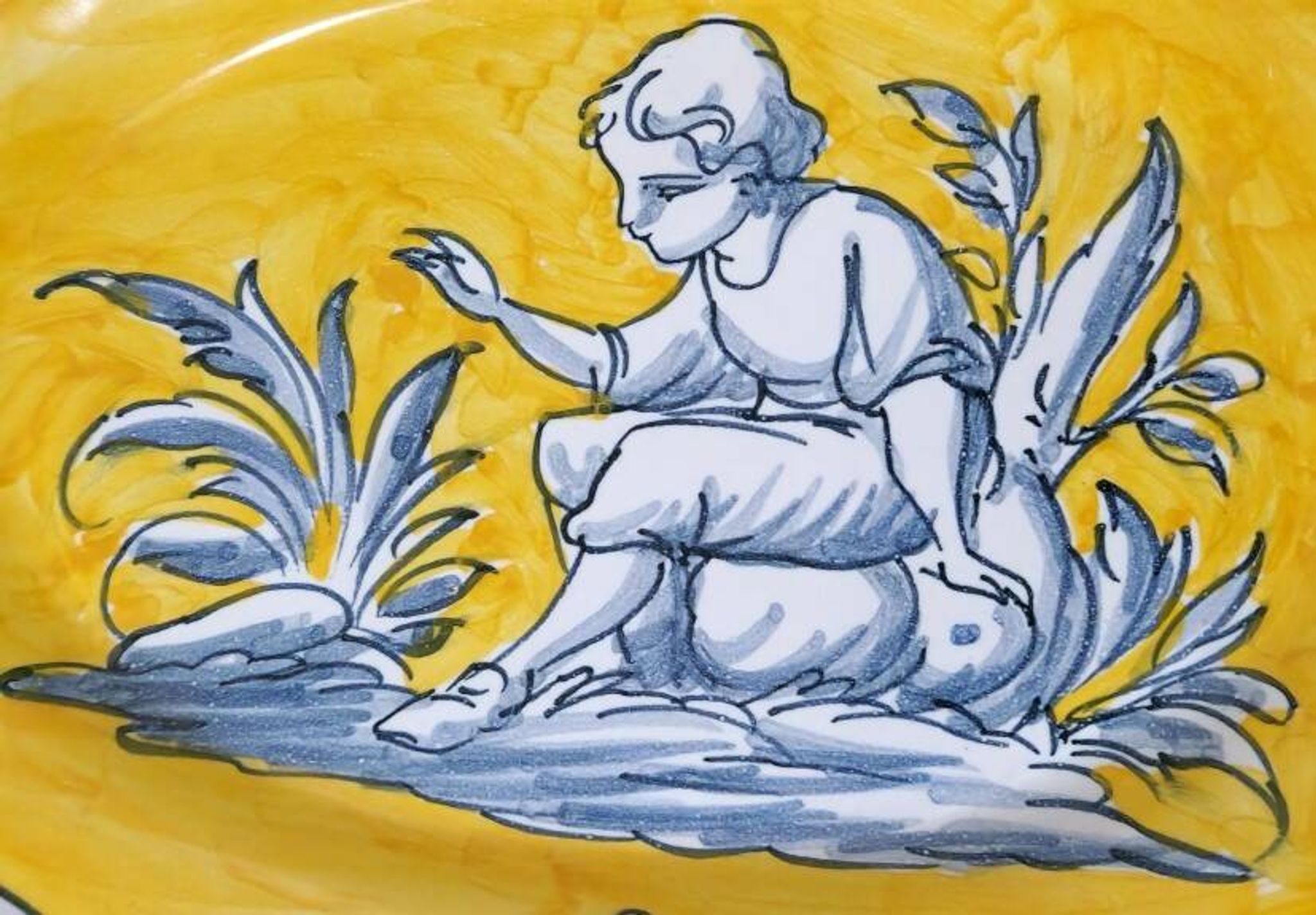 Pair of oval dishes in hand-painted faience with an Italian majolica spirit.