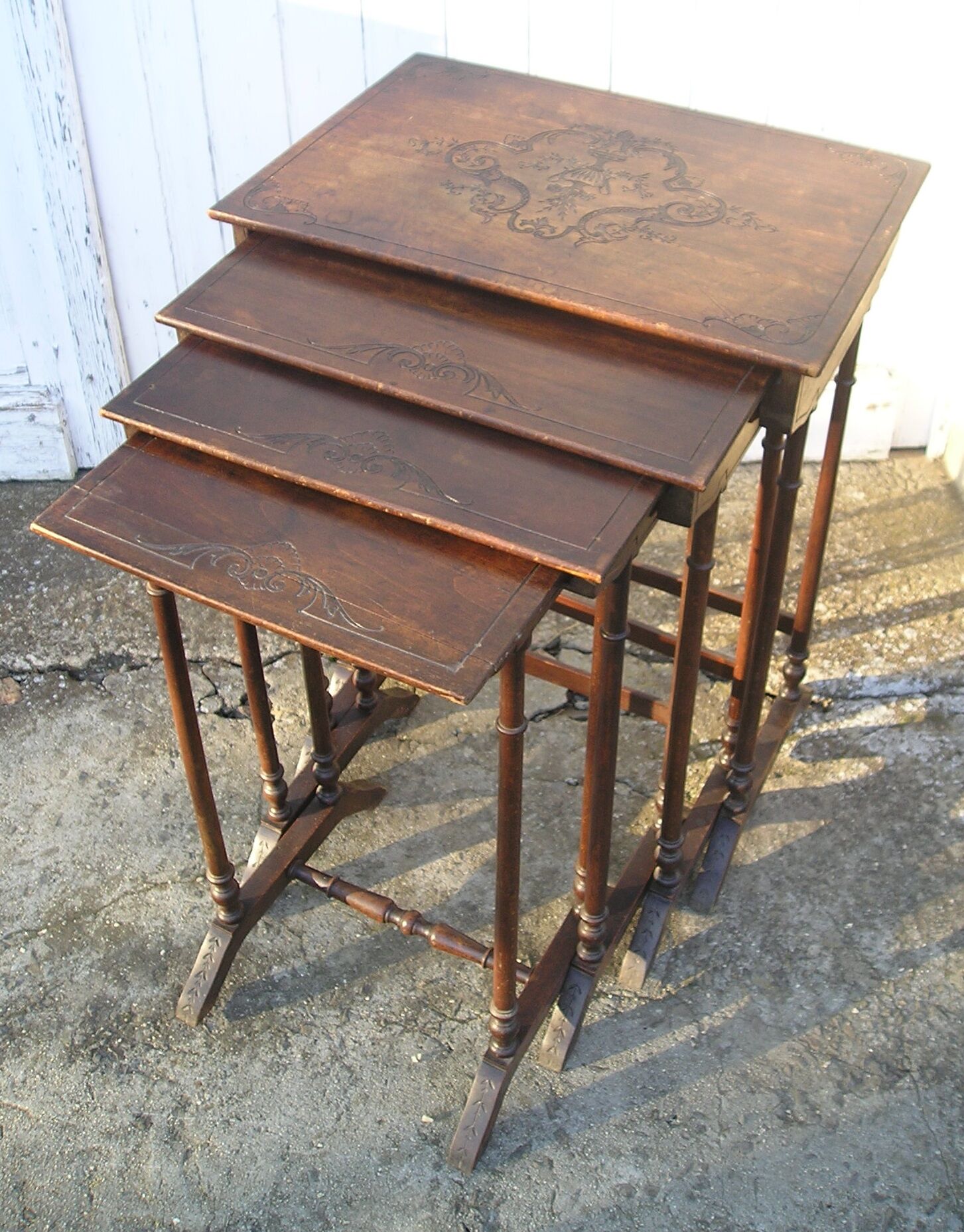 Set of 4 old tables with carved trays