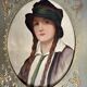 Old portrait of a young woman with braids and a hat, circa 1930