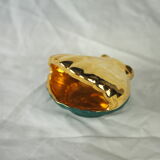 Porcelain pocket tray in the shape of a golden scallop shell with duck green background from the 50s/60s