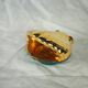 Porcelain pocket tray in the shape of a golden scallop shell with duck green background from the 50s/60s