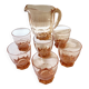 Pitcher and 6 water glasses in pink glass