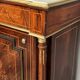 Elegant Napoleon III style commode with fine marquetry, gilded bronze mounts, and a marble top.