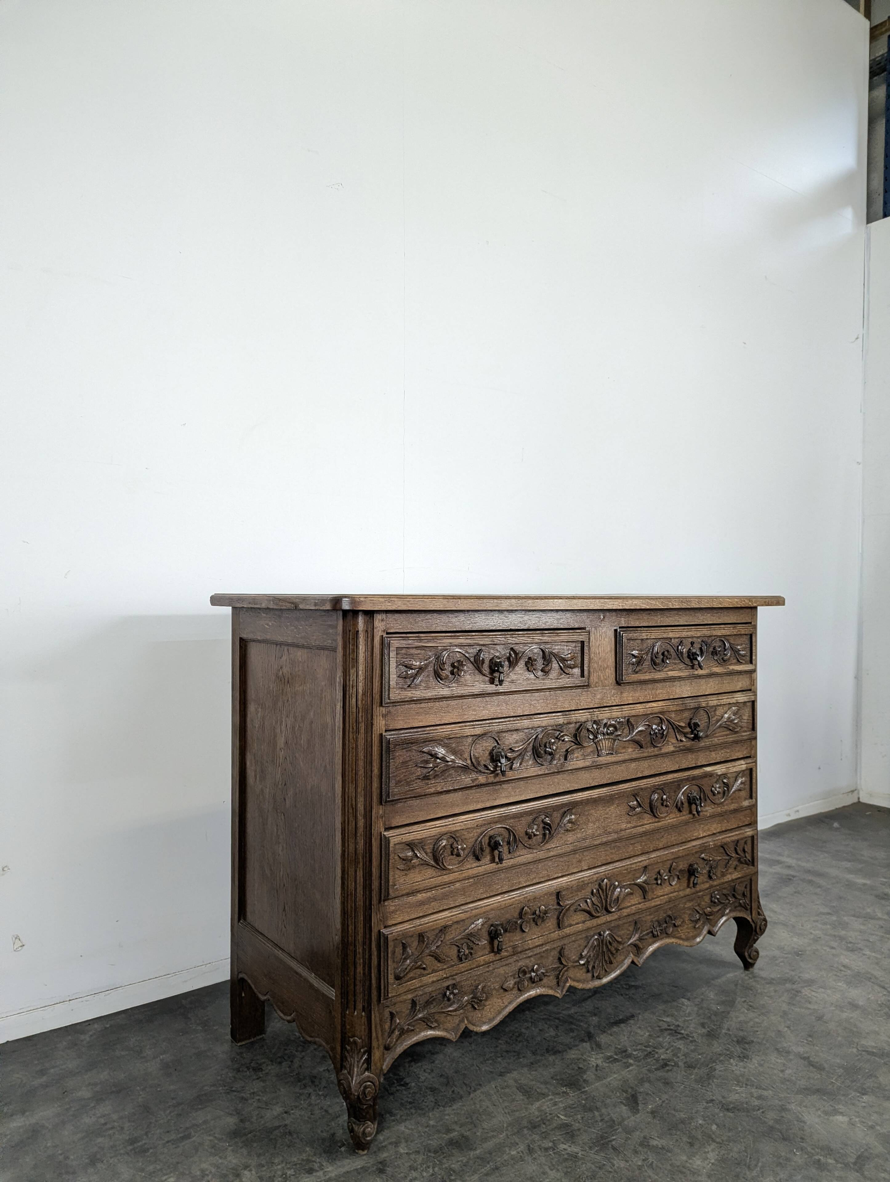 Carved neo-rustic commode in Norman style