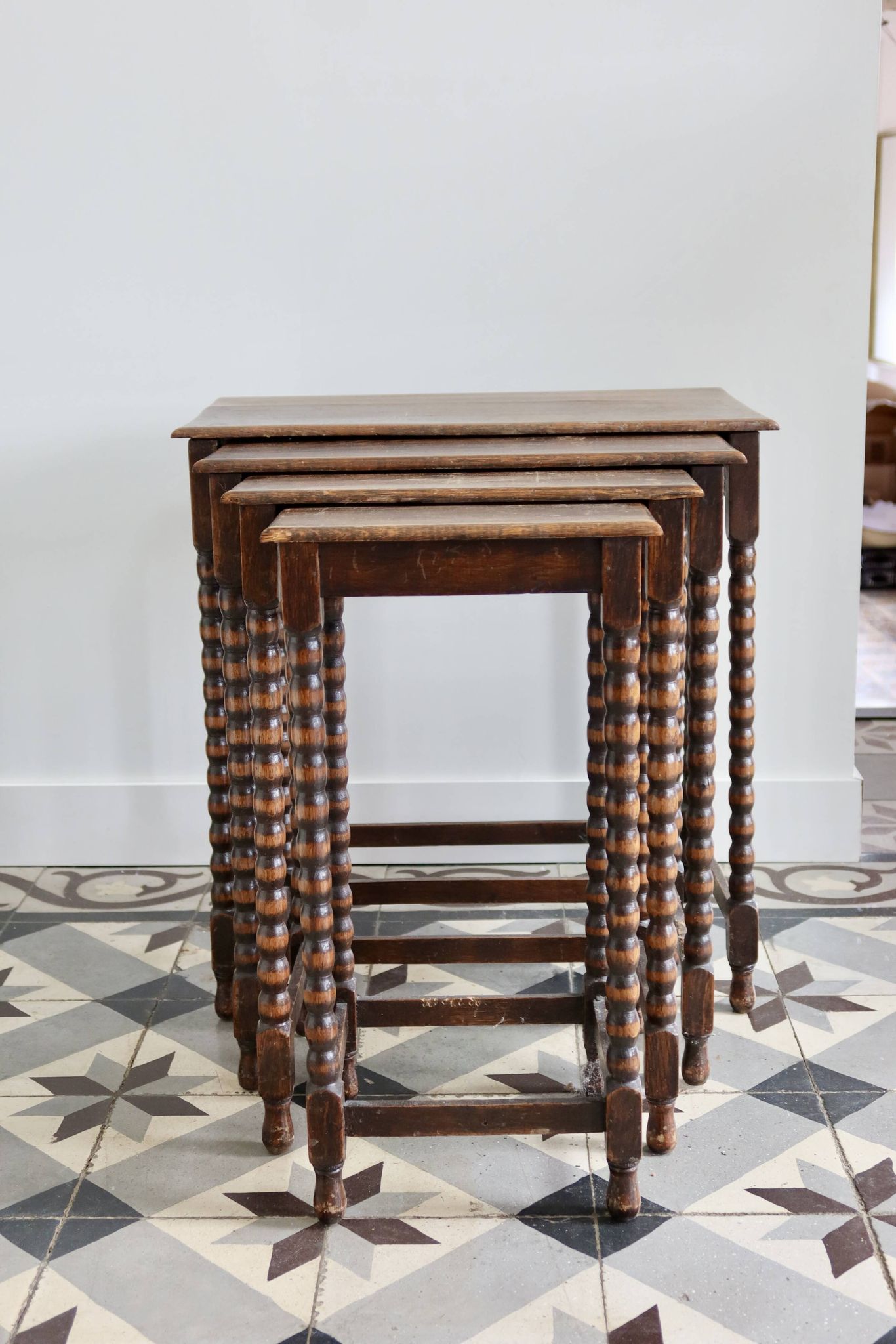 4 antique nesting tables made of turned wood