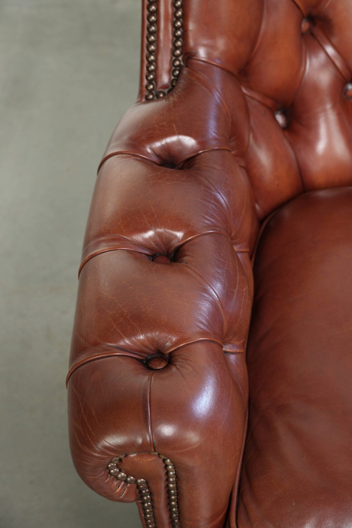 Cognac-coloured cow leather Chesterfield armchair in English style