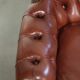 Cognac-coloured cow leather Chesterfield armchair in English style