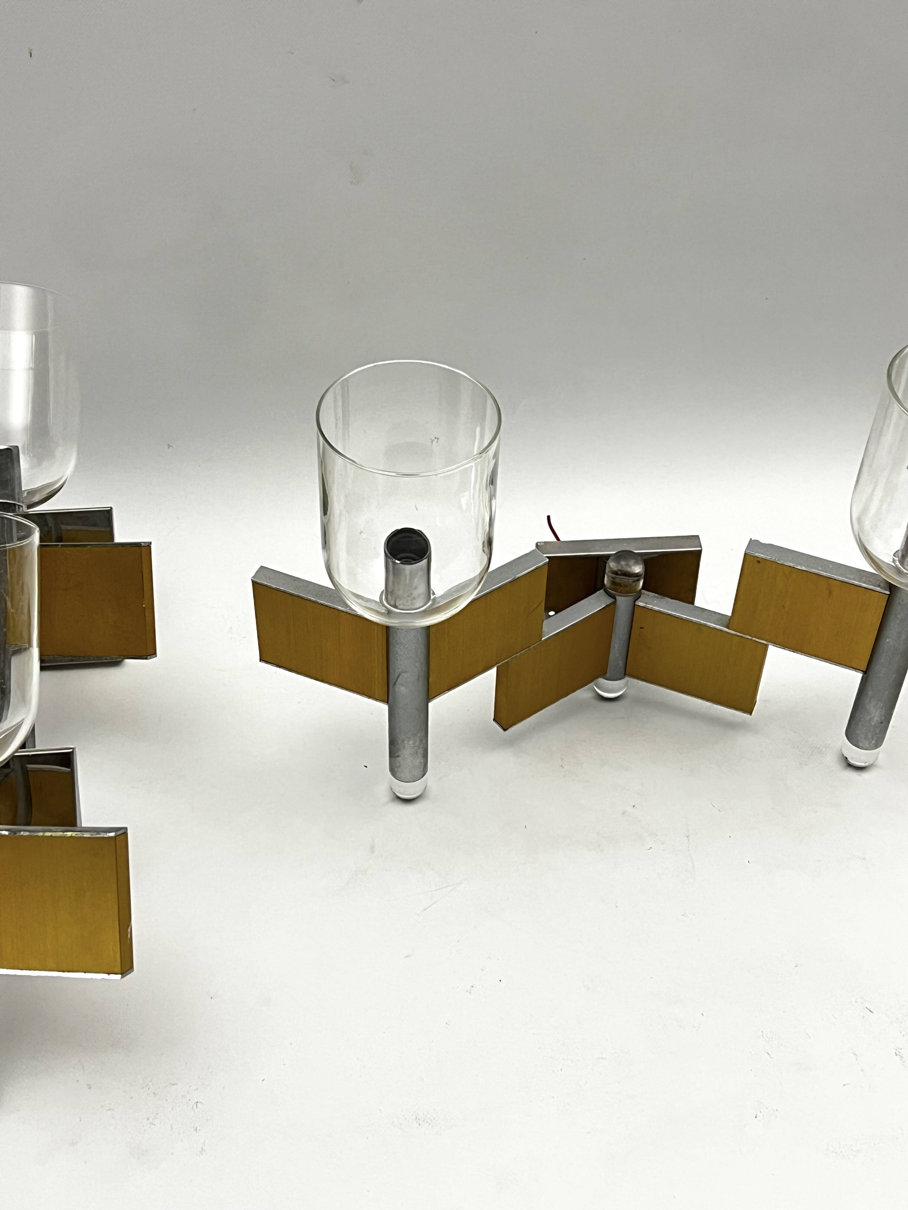 Mid-Century Modern set of eight brass and chrome sconces by Sciolari. Italy 1970s