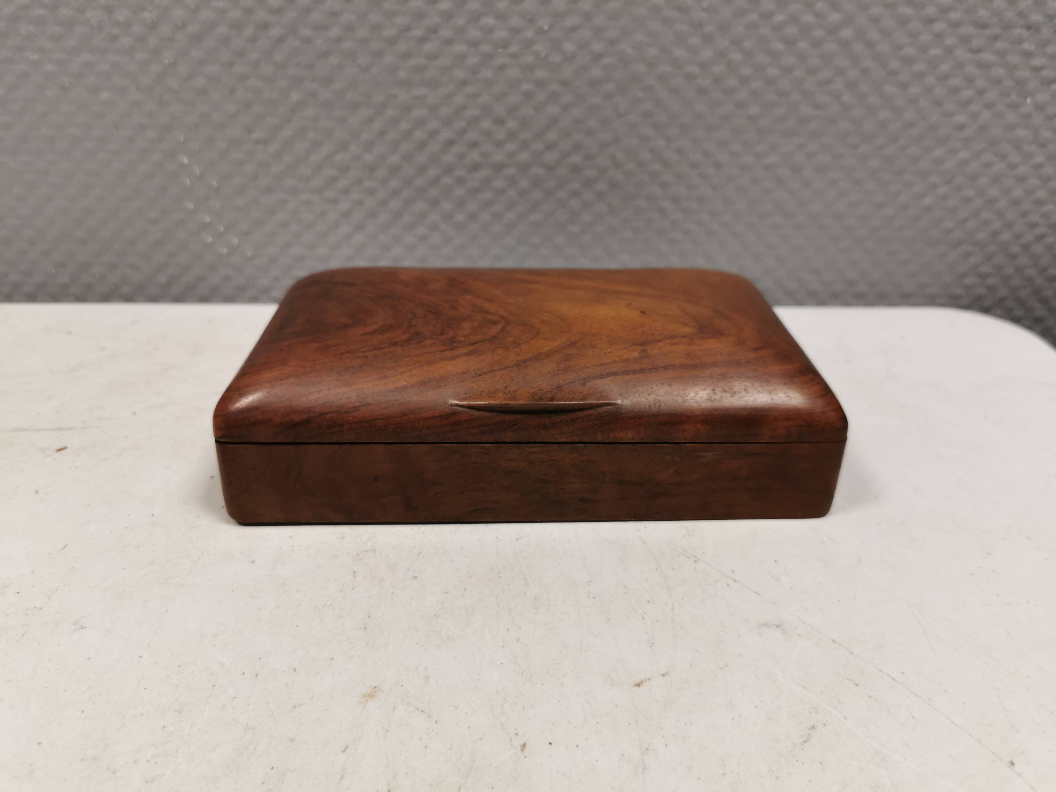 Wooden trinket box for storing jewellery, cigarettes or similar items.