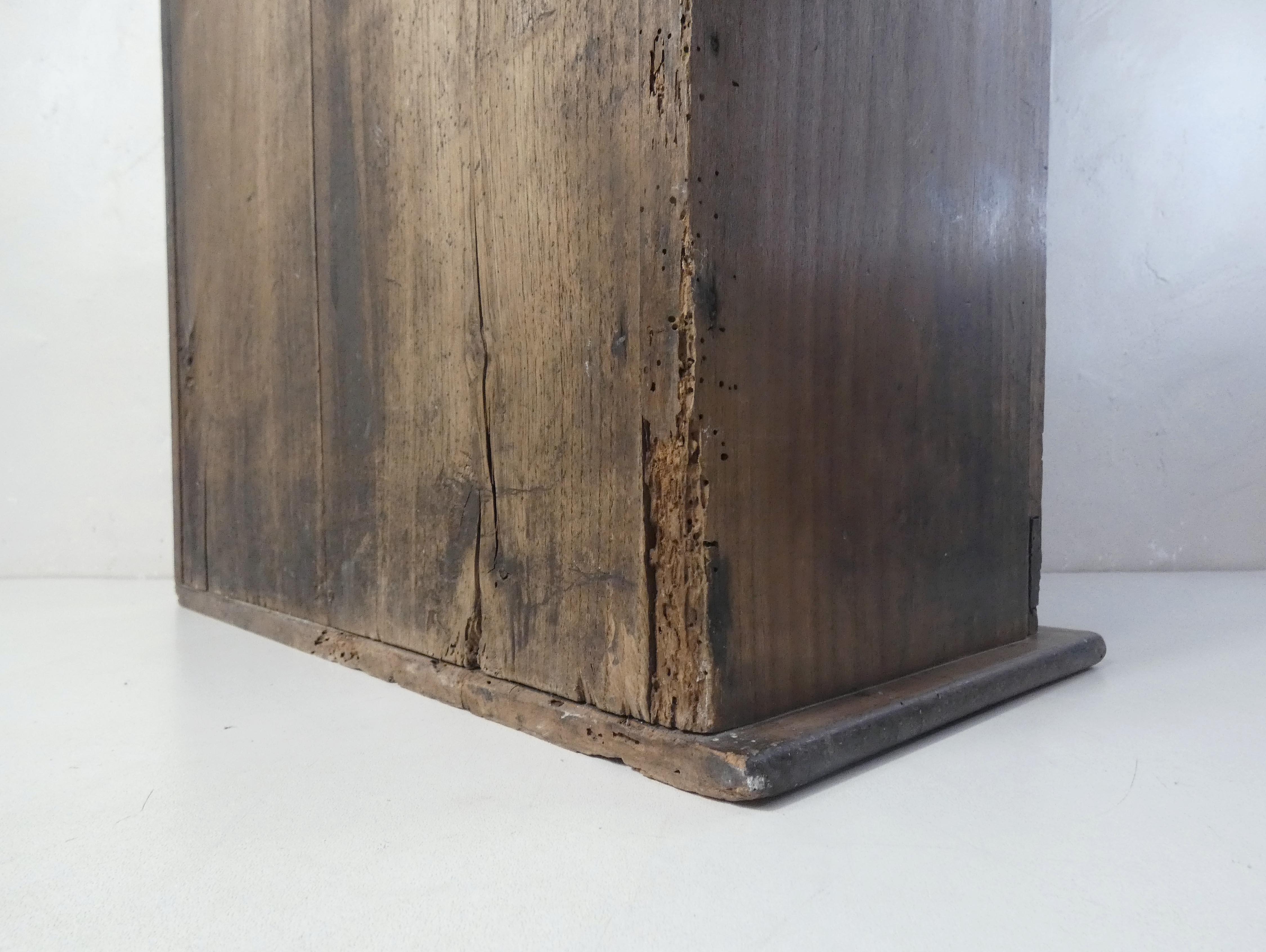 Old niche shelf with glazed statue