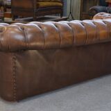 Fawn-colored tufted Chesterfield sofa