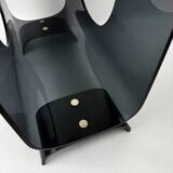 Vintage 1970s smoked plexiglass magazine rack, minimalist design.