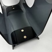 Vintage 1970s smoked plexiglass magazine rack, minimalist design.