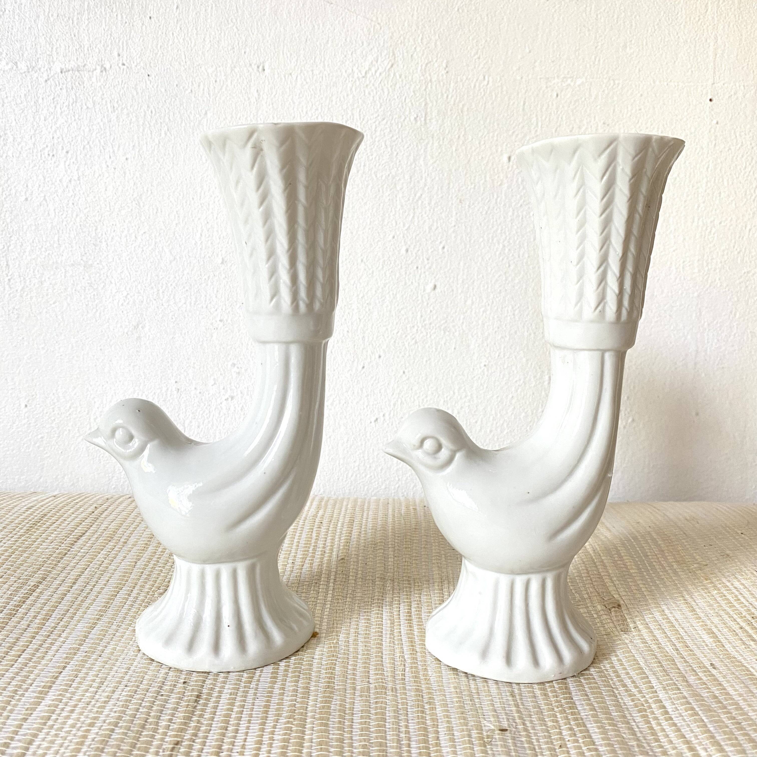Pair of porcelain candle holders and bird vases