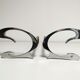 Pair of andirons in brushed steel and metal edition Jean-Paul Créations circa 1970
