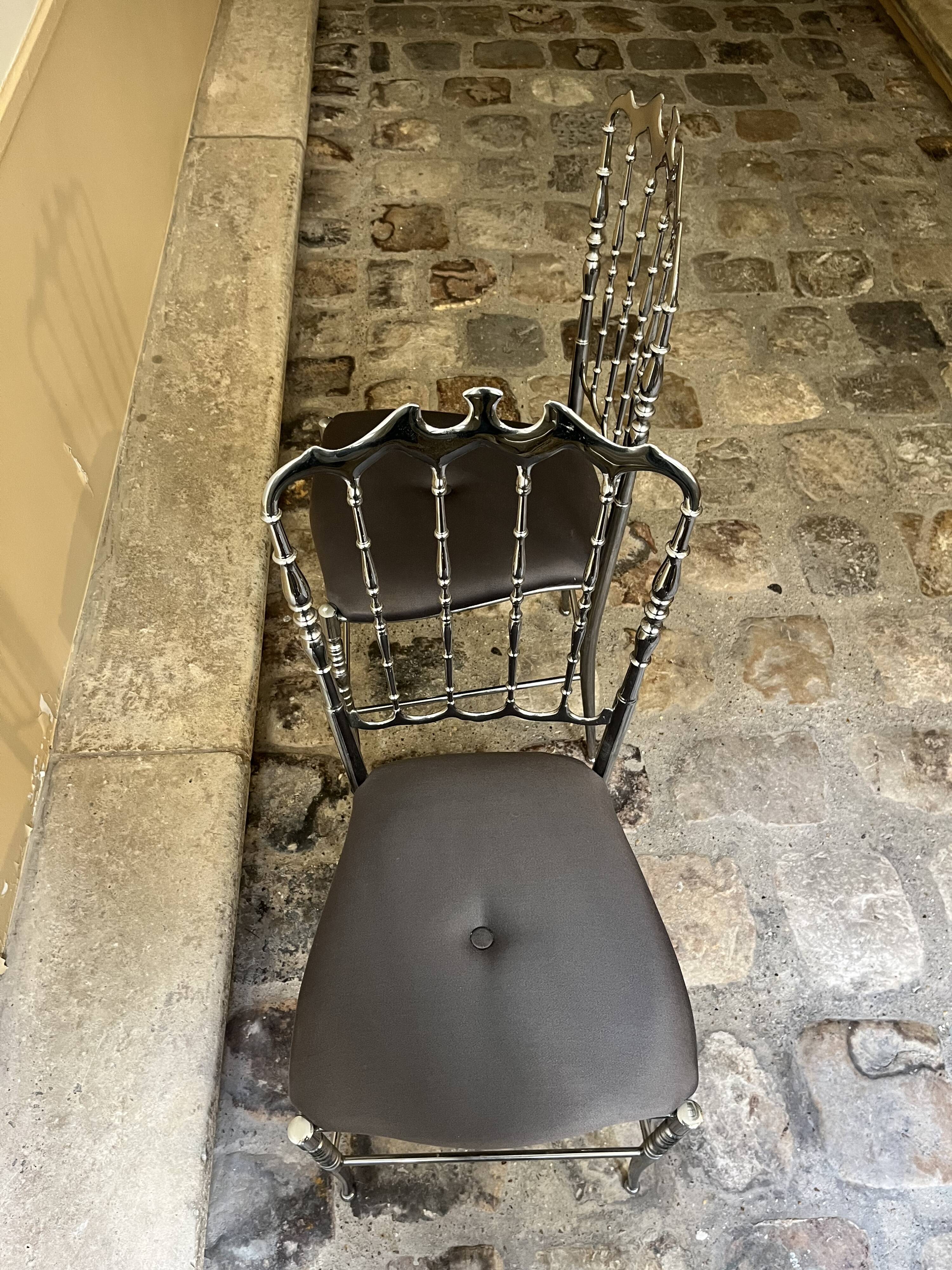 Pair of Chiavari chairs in polished mirror aluminium.