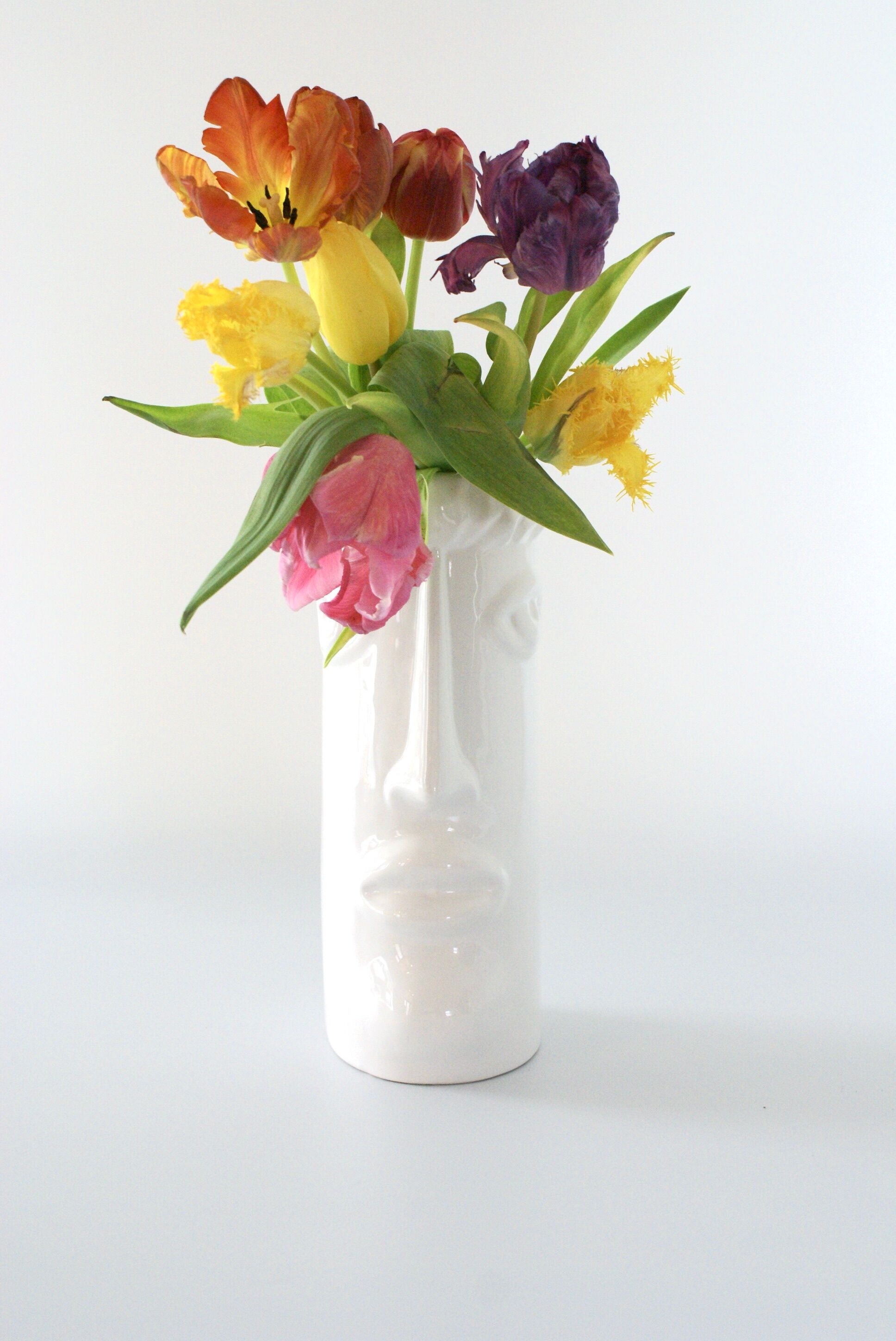 White glazed ceramic vase with face