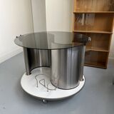 Vintage metal and smoked glass coffee table on casters bar