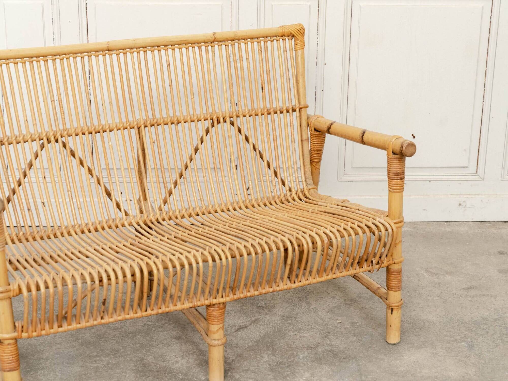 Vintage bamboo and rattan bench from the 1970s.
