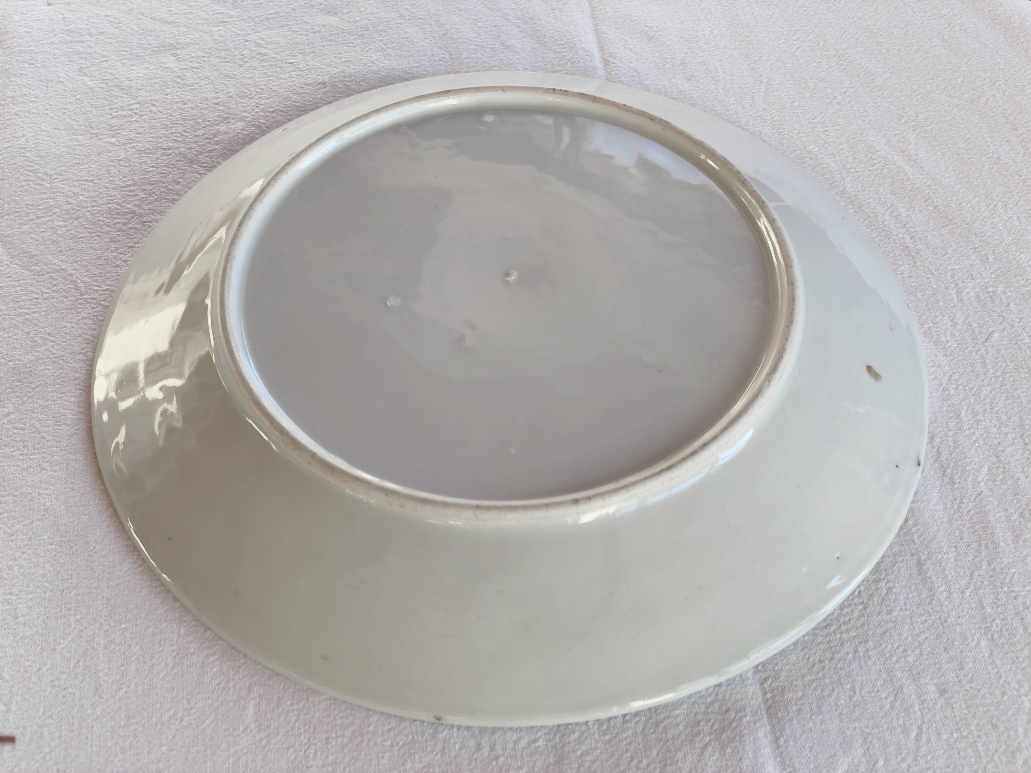 Yellow porcelain plate with saturated and vivid colors. Handmade in Japan