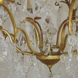French Louis XV chandelier with 8 lights in gilded bronze, glass and crystal.