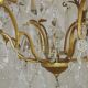 French Louis XV chandelier with 8 lights in gilded bronze, glass and crystal.