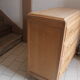 Commode aux pieds compas en bois brut
