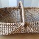 Burgundy basket in braided wicker