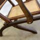 Antique folding chair with weaved seat/back