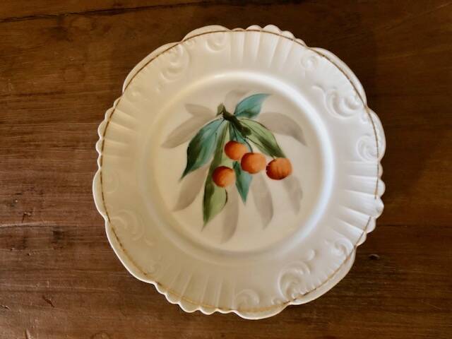 antique earthenware plate with cherries