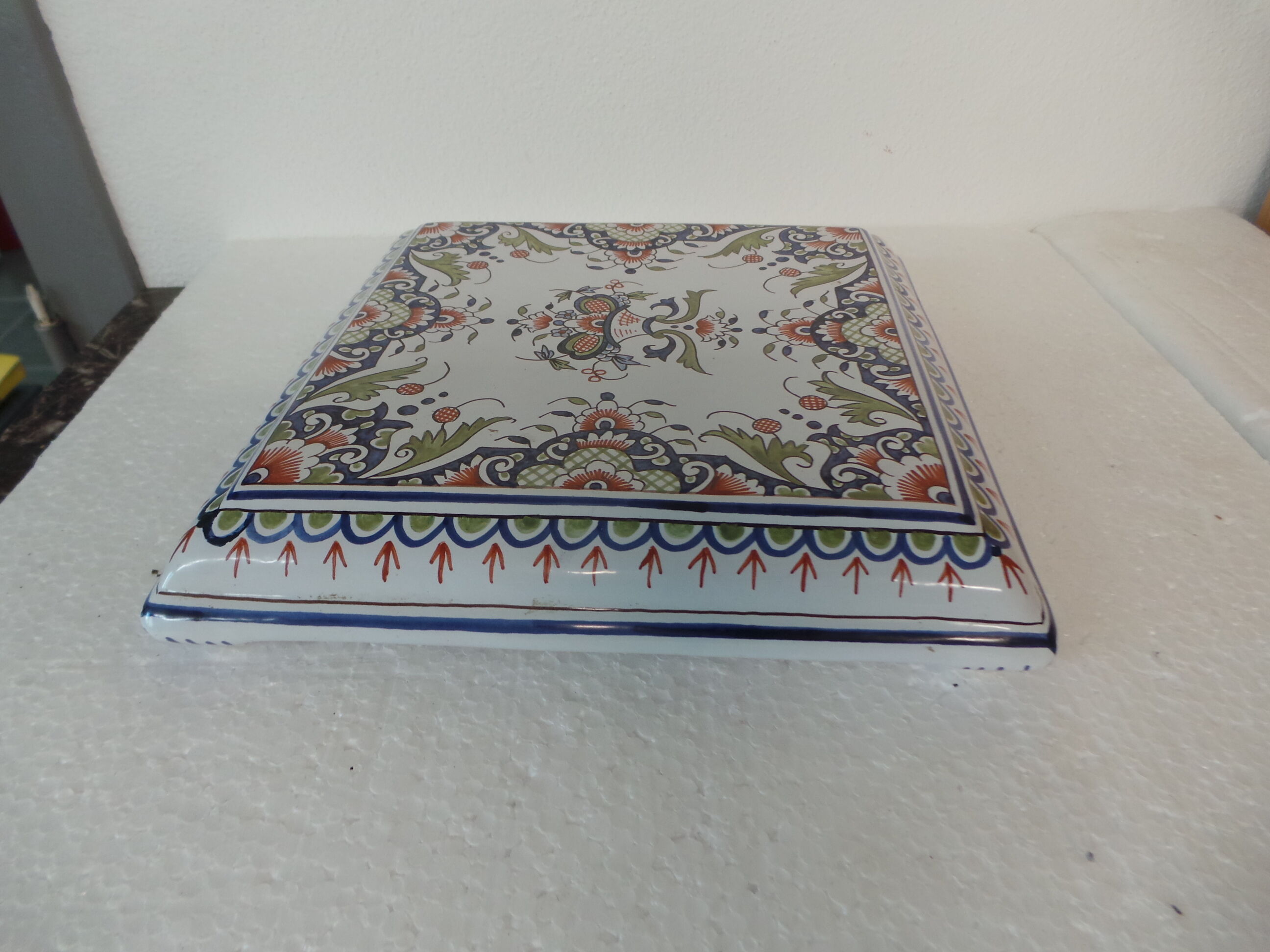 Table mat of rouen faience hand-painted floral decoration