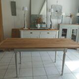 Farmhouse table with pearl gray base and raw wood top.
