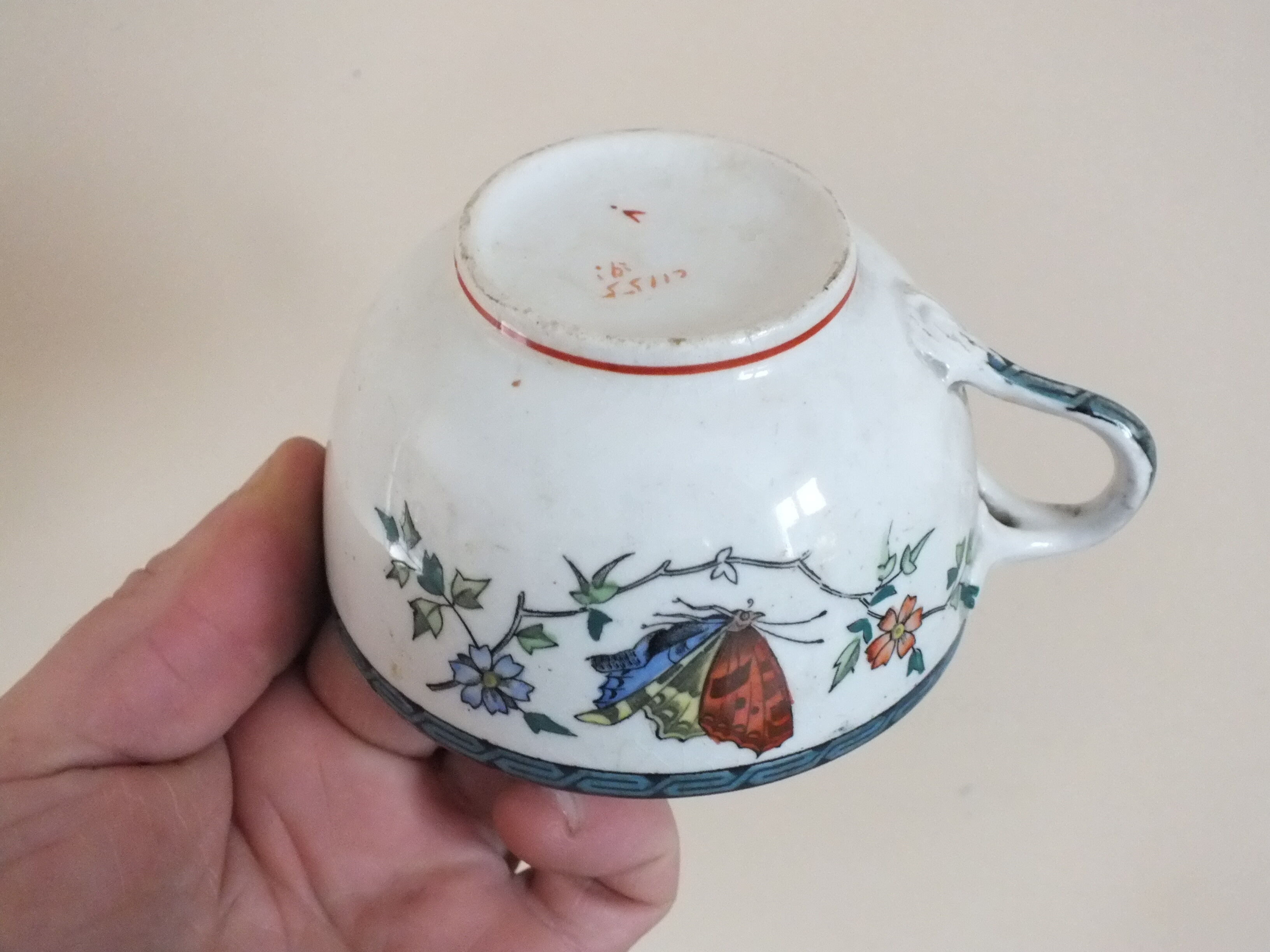 3 cups of English porcelain decorated with butterflies