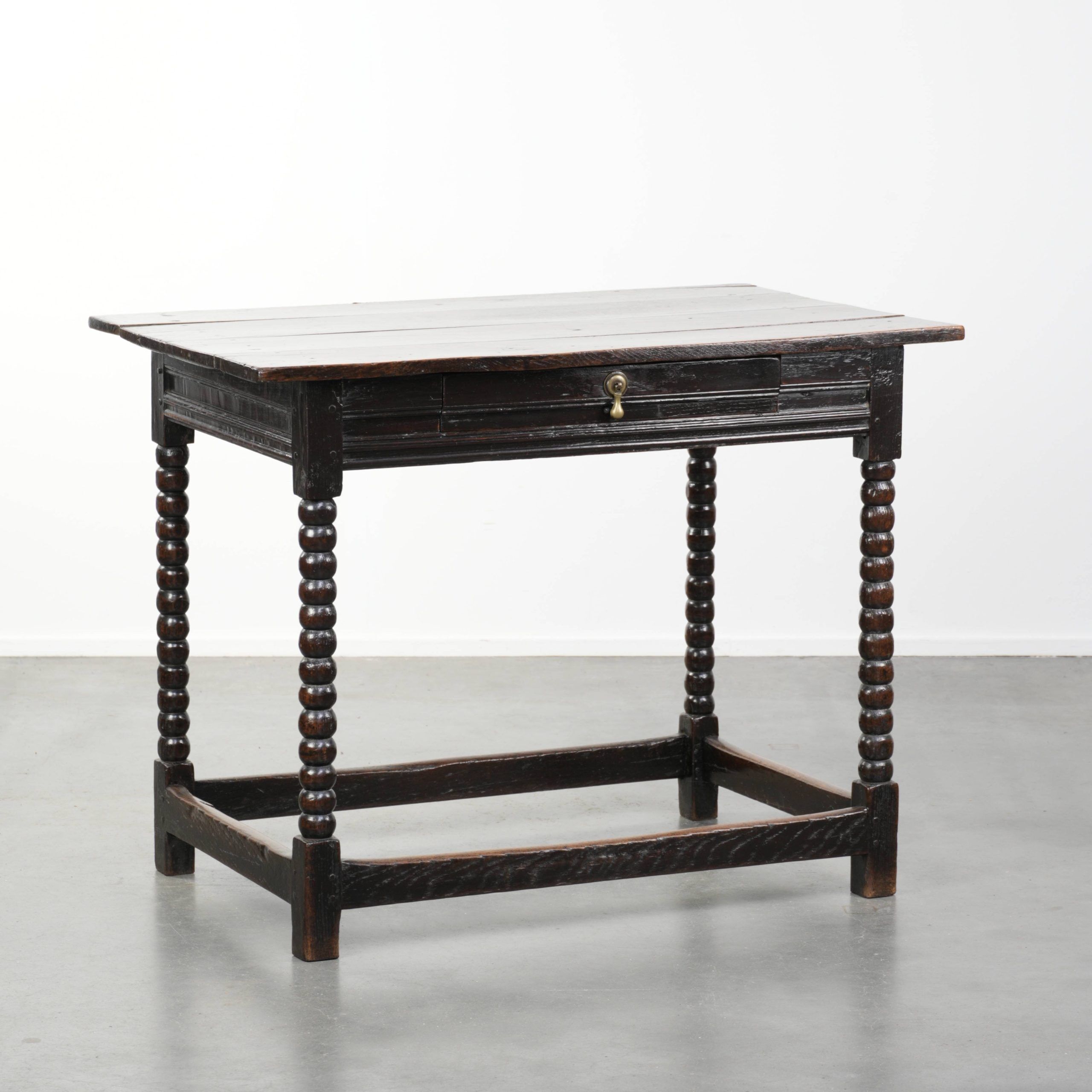 Antique English oak side table from the 18th century with bobbin legs