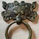 Ancient door knocker, taotié mask, shang dynasty. in bronze golden patina