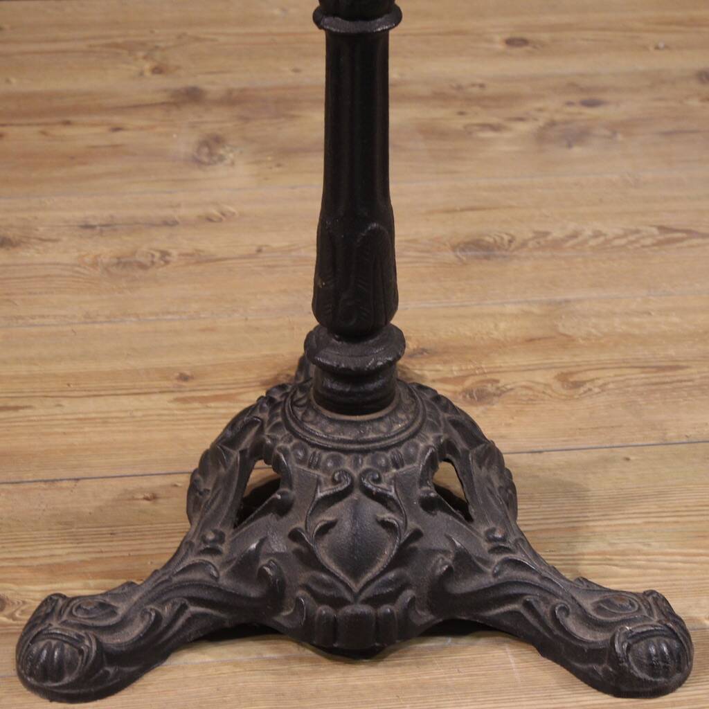20th-century French iron bistro table with a marble top.